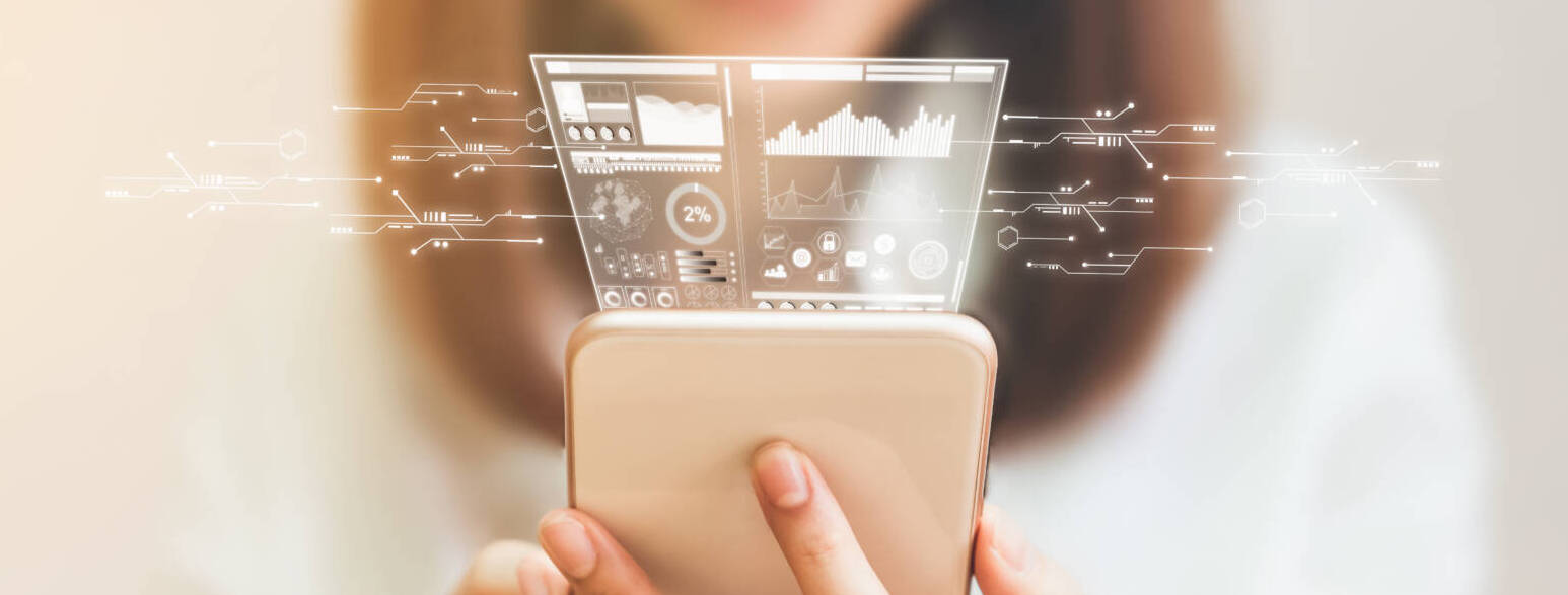 Women Using A Smartphone In The Display And Technology Advances In Stores. Take Your Screen To Put On Advertising.