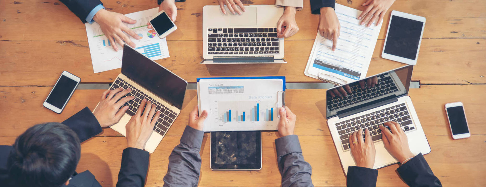 Group Of People Working Together With Laptop On Wooden Office De